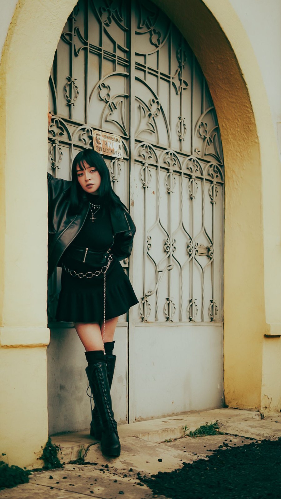 Goth leg warmers look with black over-the-knee lace-up boots and dark layers